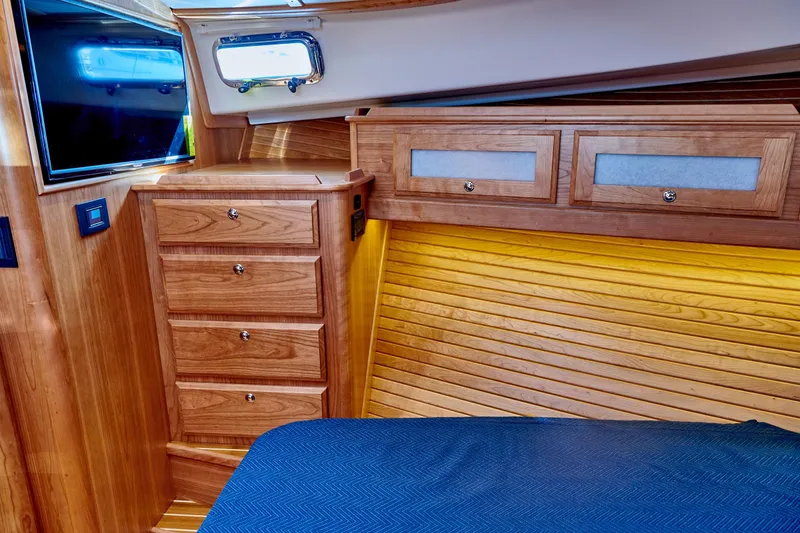 Slide: The Image of Interior of 2027 Sabre 45 Salon Express with wooden furnishings. - 21