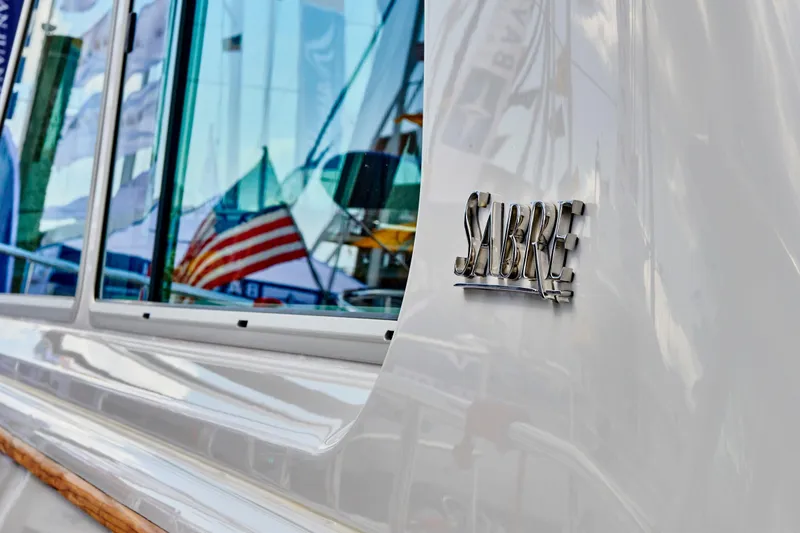 Slide: The Image of 2027 Sabre 45 Salon Express with flag reflection in window. - 32