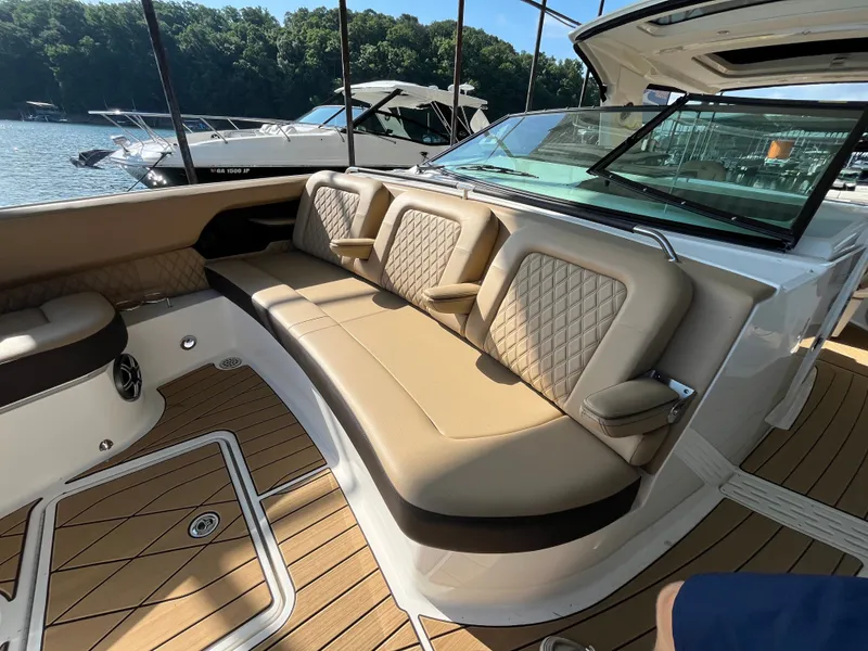 Slide: The Image of The image shows the cockpit of a Sea Ray SLX 400 with elegant beige upholstery. - 19