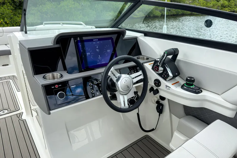 Slide: The Image of 2026 Sea Ray SDX 290 Outboard cockpit with modern controls. - 12