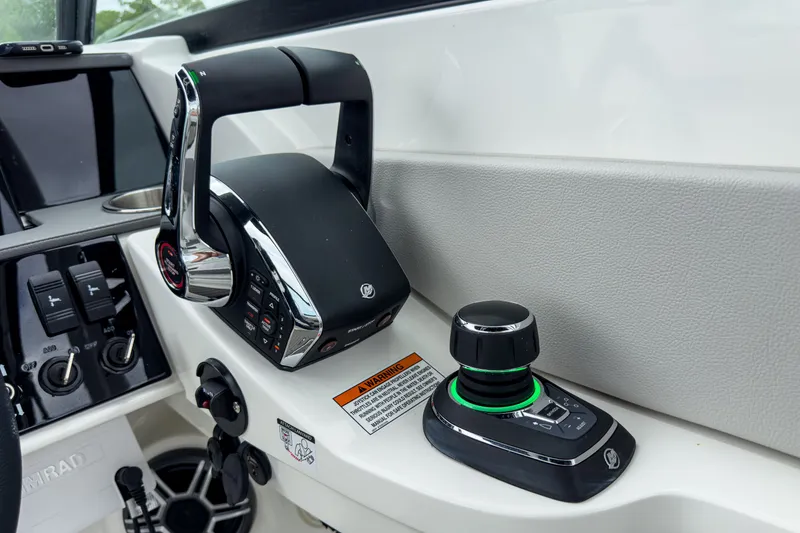Slide: The Image of Control console of 2026 Sea Ray SDX 290 Outboard with controls. - 13