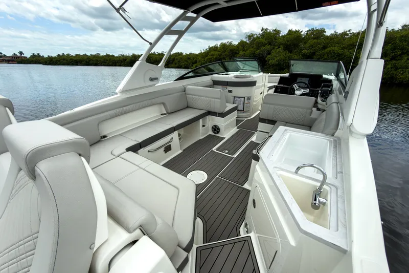 Slide: The Image of Interior of Sea Ray SDX 290 Outboard 2026 on calm water. - 6
