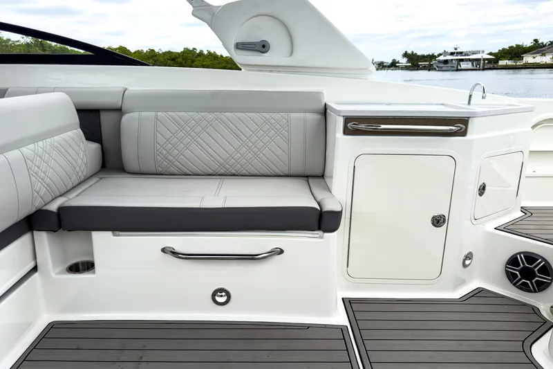 Slide: The Image of Interior of 2026 Sea Ray SDX 290 Outboard with seating and cabinet. - 9
