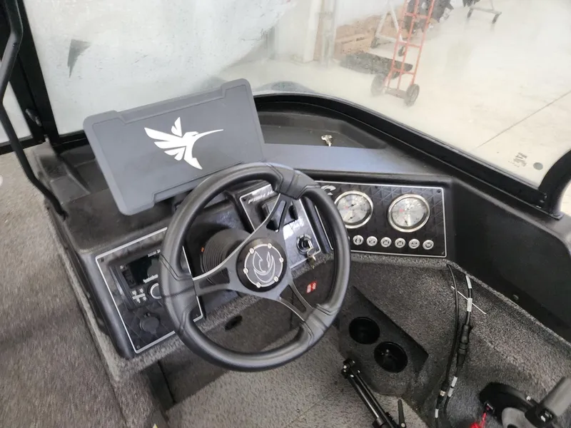 Slide: The Image of Interior view of 2025 Crestliner 1850 Fish Hawk WT cockpit. - 10