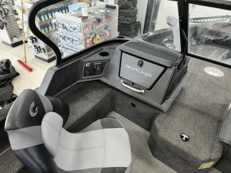 Slide: The Image of Interior of 2025 Crestliner 1850 Fish Hawk WT with seat and console. - 14