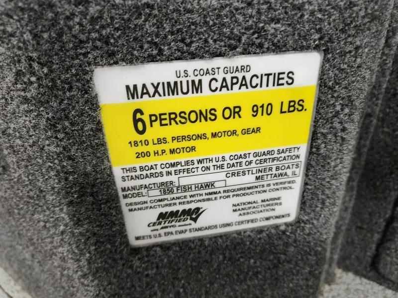 Slide: The Image of Crestliner 1850 Fish Hawk WT 2025 capacity label, 6 persons or 910 lbs. - 27