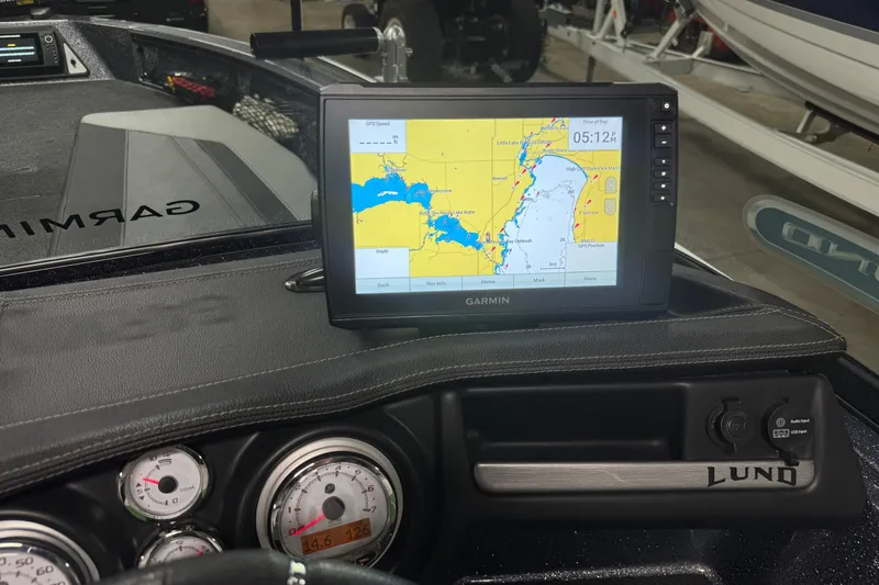Slide: The Image of 2022 Lund 202 Pro-V GL boat dashboard with Garmin GPS navigation system. - 13