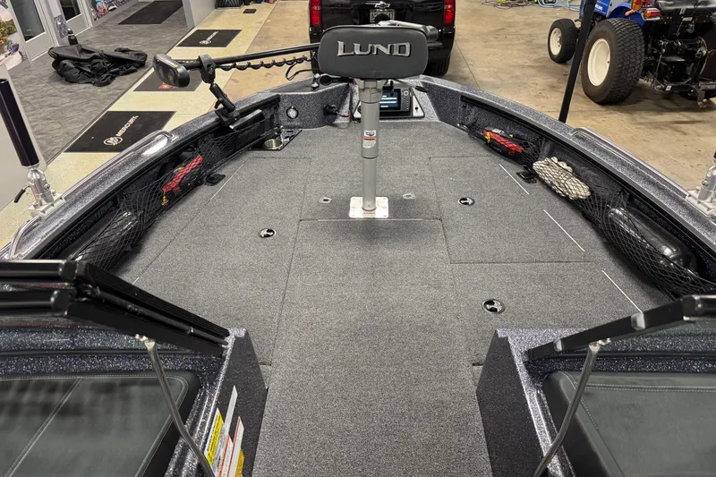 Slide: The Image of 2022 Lund 202 Pro-V GL boat interior with fishing deck and equipment. - 19