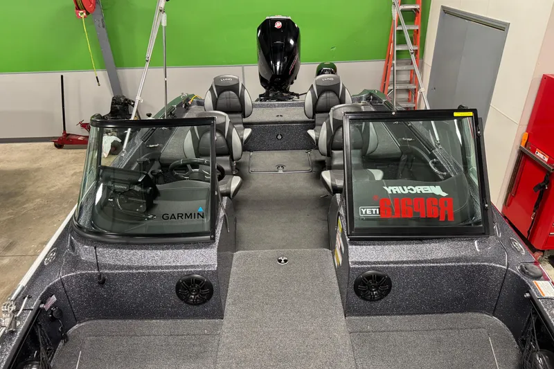 Slide: The Image of 2022 Lund 202 Pro-V GL boat interior with Garmin equipment and Mercury engine. - 25