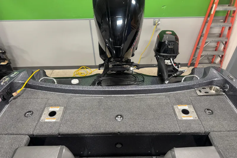 Slide: The Image of 2022 Lund 202 Pro-V GL boat interior with motor, ladder, and storage compartments. - 29