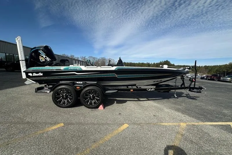The Image of 2026 Bass Cat Jaguar STS boat on trailer, parked outdoors under a clear sky. - 0