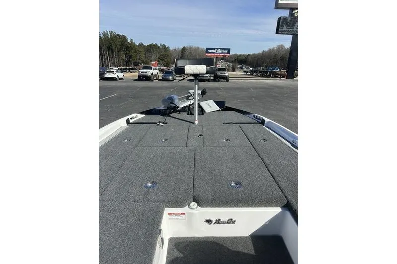 Slide: The Image of 2026 Bass Cat Jaguar STS boat deck with seating and storage compartments. - 1