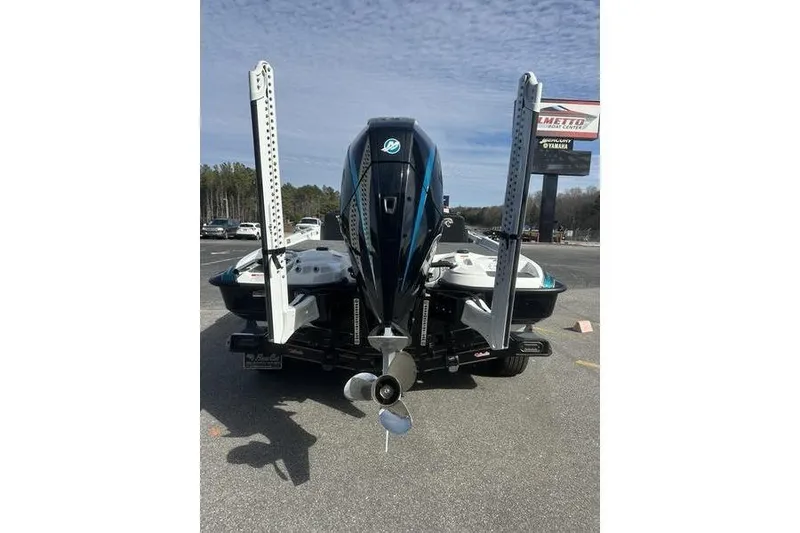 Slide: The Image of 2026 Bass Cat Jaguar STS boat rear view with powerful outboard motor. - 3