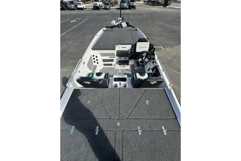 Slide: The Image of 2026 Bass Cat Jaguar STS boat interior with advanced navigation system and spacious seating. - 5