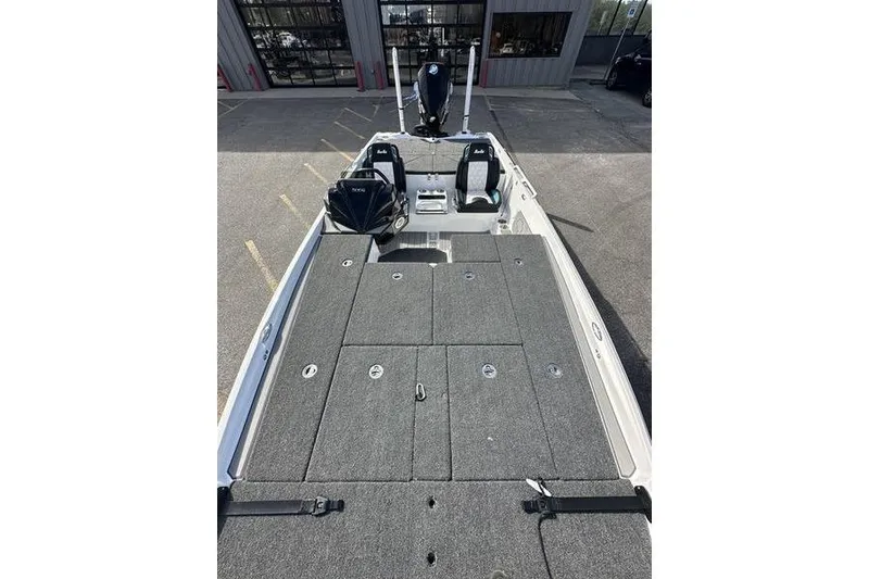 Slide: The Image of 2026 Bass Cat Jaguar STS boat interior with spacious deck and seating. - 6