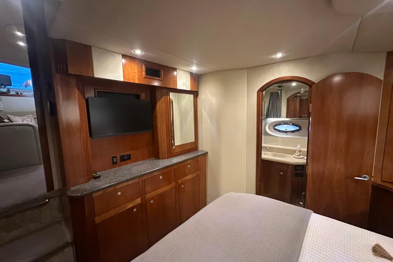 Slide: The Image of Luxurious 2008 Cruisers Yachts 415 Express Motoryacht interior with wood cabinetry and ensuite bathroom. - 11