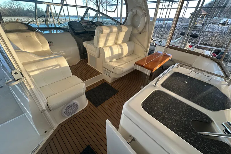 Slide: The Image of 2008 Cruisers Yachts 415 Express Motoryacht interior with seating and helm, featuring elegant design. - 3