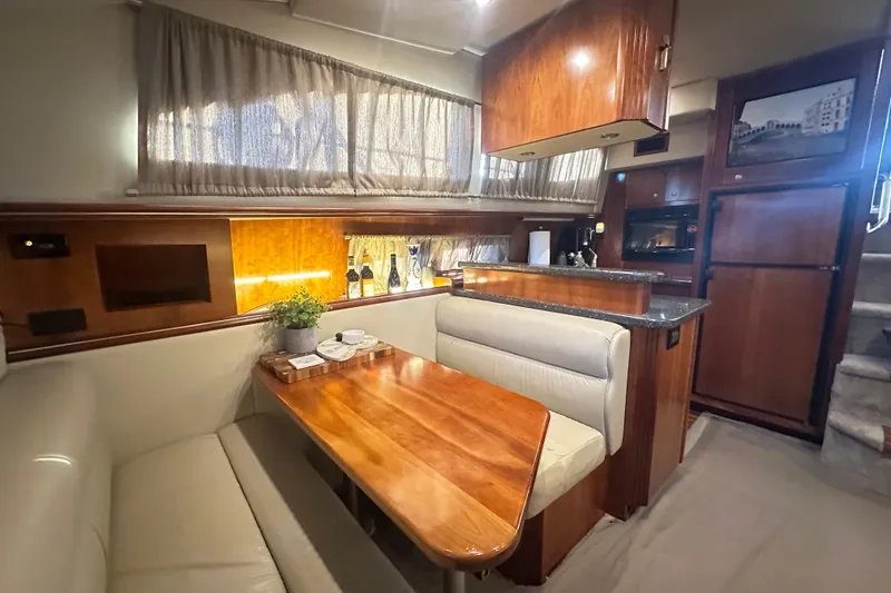 Slide: The Image of Luxurious interior of 2008 Cruisers Yachts 415 Express Motoryacht with elegant dining area. - 9