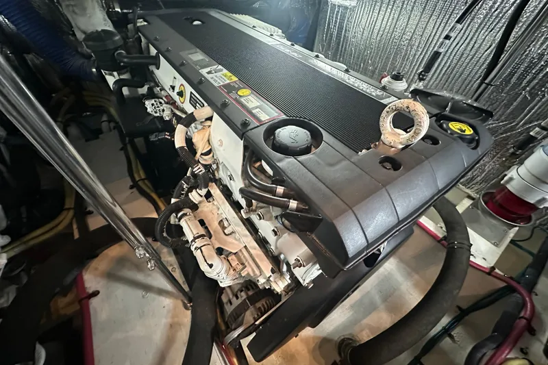 Slide: The Image of Engine room of 2008 Cruisers Yachts 415 Express Motoryacht, showcasing detailed machinery. - 23