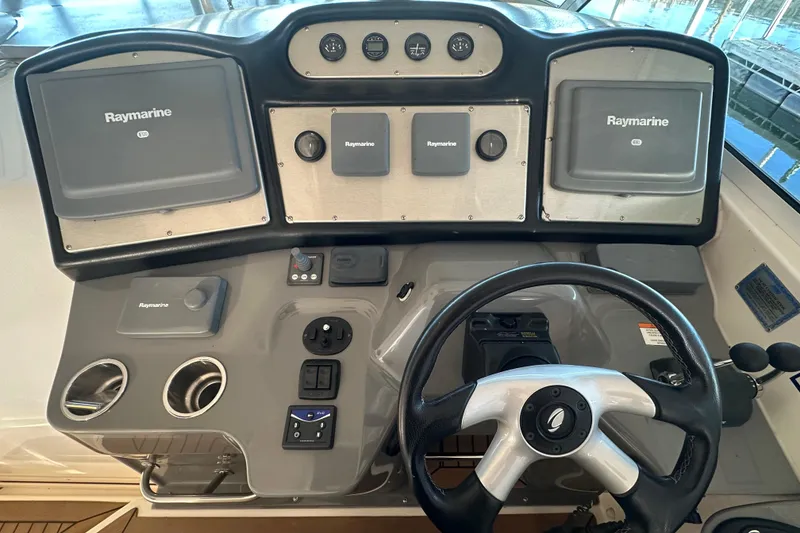 Slide: The Image of 2008 Cruisers Yachts 415 Express Motoryacht helm with Raymarine navigation systems. - 4