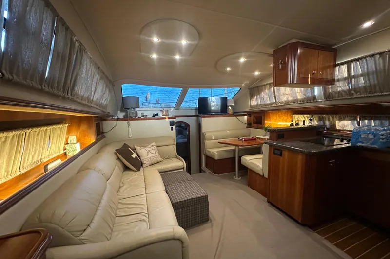 Slide: The Image of Luxurious interior of 2008 Cruisers Yachts 415 Express Motoryacht with elegant seating and dining area. - 5