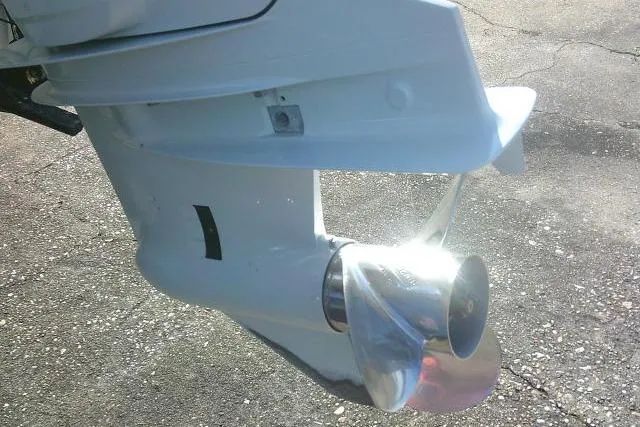 Slide: The Image of Close-up of a 2022 Carolina Skiff 21 Ultra Elite boat propeller on pavement. - 13