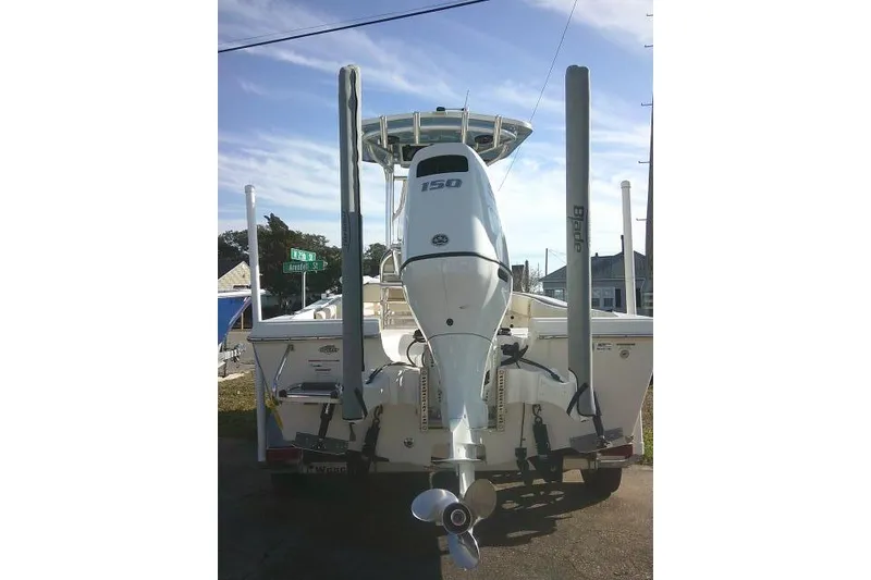 Slide: The Image of 2022 Carolina Skiff 21 Ultra Elite boat with 150 HP outboard motor, rear view. - 14