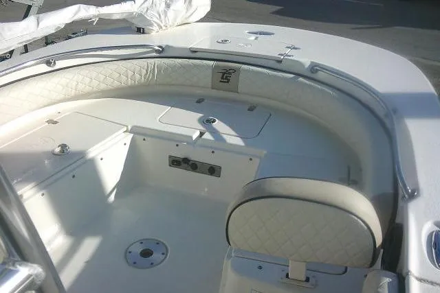 Slide: The Image of 2022 Carolina Skiff 21 Ultra Elite boat interior with cushioned seating and storage compartments. - 22