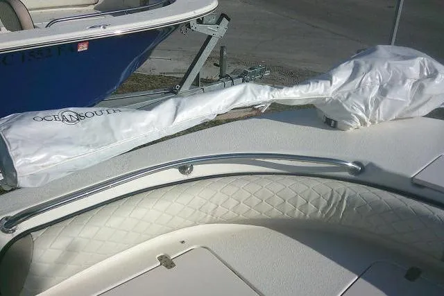 Slide: The Image of 2022 Carolina Skiff 21 Ultra Elite boat with covered equipment on deck. - 24
