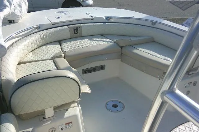 Slide: The Image of 2022 Carolina Skiff 21 Ultra Elite boat interior with cushioned seating and storage. - 30