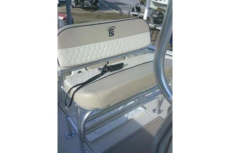 Slide: The Image of 2022 Carolina Skiff 21 Ultra Elite boat seat with beige upholstery and chrome frame. - 36