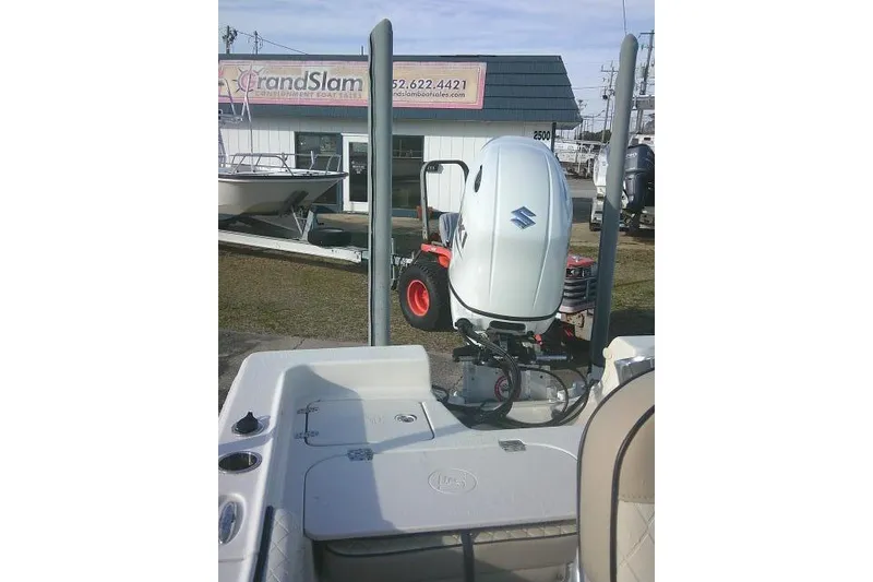 Slide: The Image of 2022 Carolina Skiff 21 Ultra Elite boat with Suzuki outboard motor at dealership. - 37