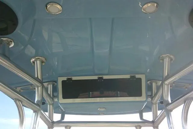 Slide: The Image of 2022 Carolina Skiff 21 Ultra Elite boat interior with blue ceiling and metal framework. - 41