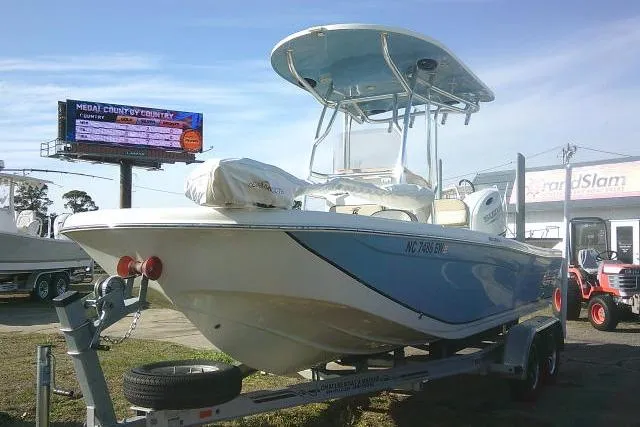 Slide: The Image of 2022 Carolina Skiff 21 Ultra Elite boat on trailer, displayed outdoors. - 5