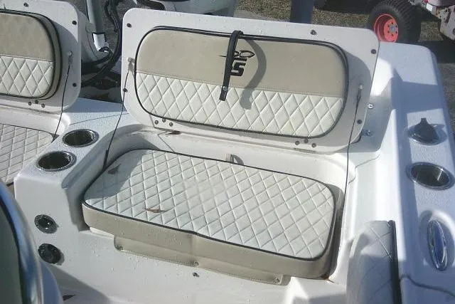 Slide: The Image of 2022 Carolina Skiff 21 Ultra Elite boat seating with cup holders and storage. - 53