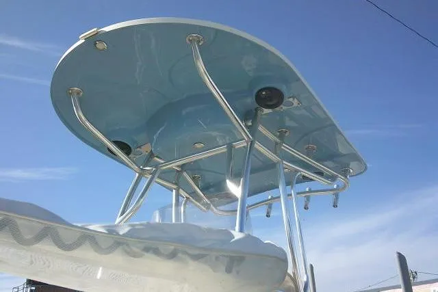 Slide: The Image of 2022 Carolina Skiff 21 Ultra Elite T-top against a clear blue sky. - 6