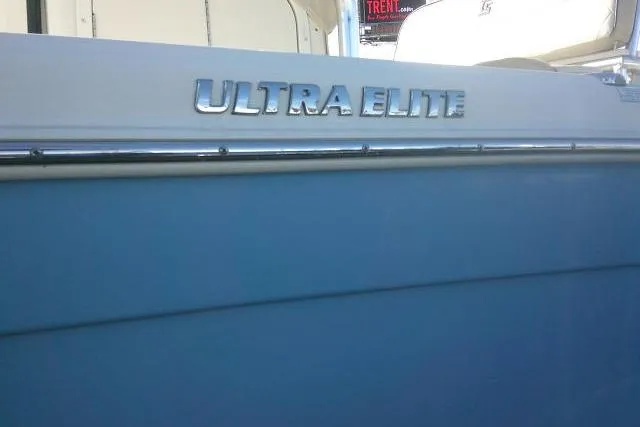 Slide: The Image of 2022 Carolina Skiff 21 Ultra Elite boat, side view with model name visible. - 7