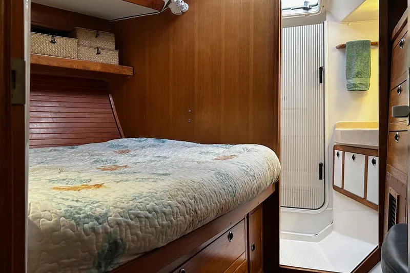 Slide: The Image of Cozy cabin interior of 1999 Catalina 42 MkII sailboat with bed and bathroom. - 14