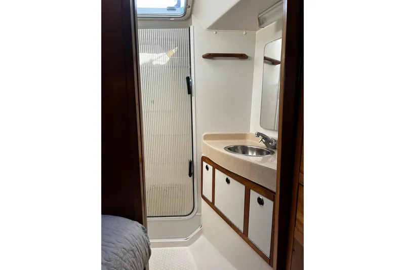 Slide: The Image of Bathroom interior of 1999 Catalina 42 MkII sailboat with sink and shower. - 15