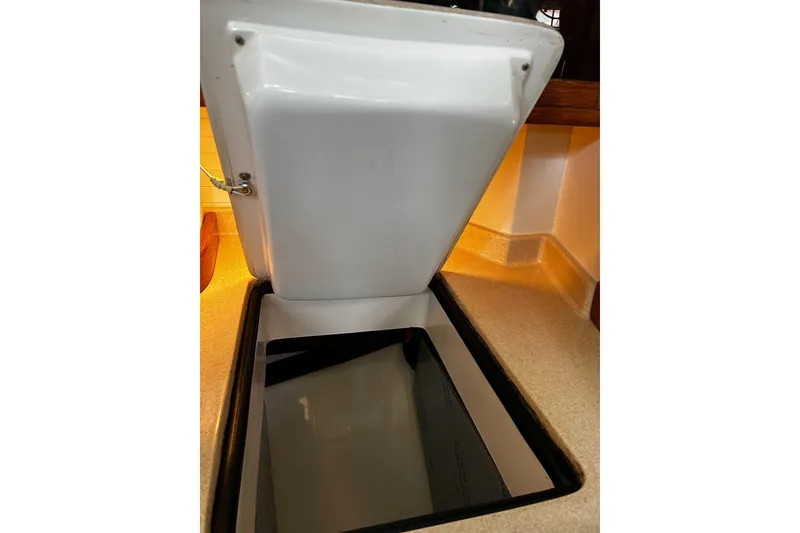 Slide: The Image of Open storage compartment on 1999 Catalina 42 MkII yacht, showcasing interior space. - 22