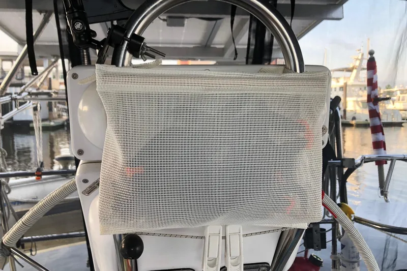 Slide: The Image of Cockpit of 1999 Catalina 42 MkII sailboat with mesh storage bag. - 28