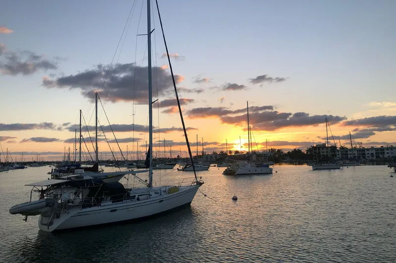Slide: The Image of Sailboats anchored at sunset, featuring a 1999 Catalina 42 MkII. - 35