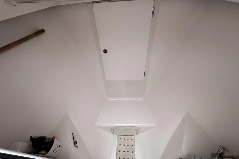 Slide: The Image of Interior of a 1999 Catalina 42 MkII sailboat, featuring a clean, white compartment. - 40