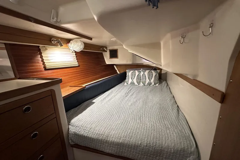 Slide: The Image of Cozy cabin interior of 1999 Catalina 42 MkII sailboat with bed and wooden accents. - 41