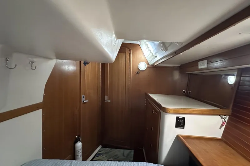 Slide: The Image of Interior cabin of a 1999 Catalina 42 MkII sailboat with wooden furnishings. - 43