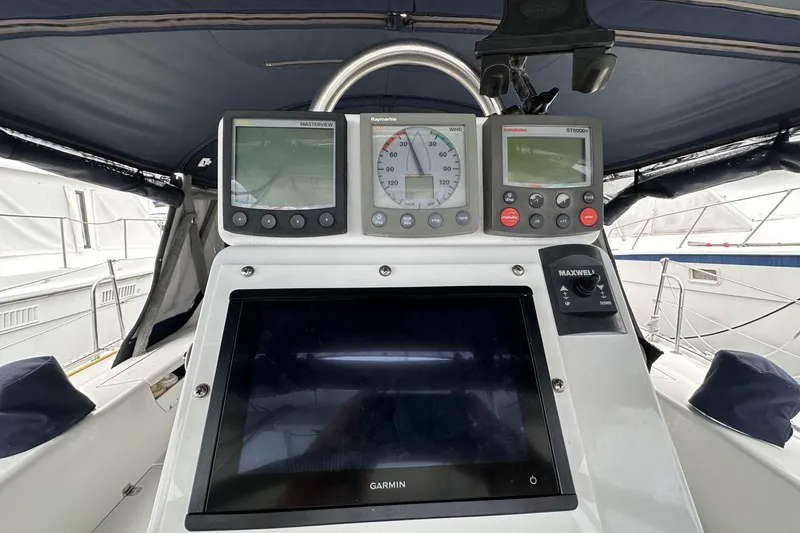 Slide: The Image of Cockpit of 1999 Catalina 42 MkII sailboat with navigation instruments and controls. - 46
