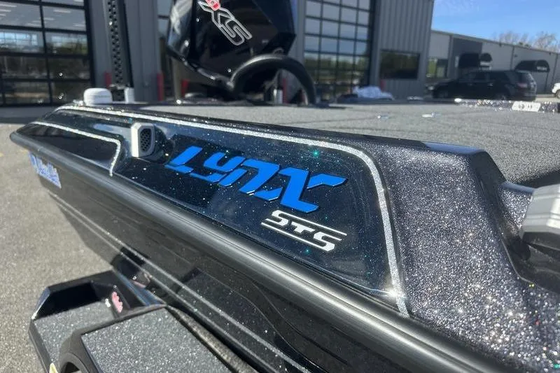 Slide: The Image of 2026 Bass Cat Lynx STS boat with sleek design and metallic finish. - 5