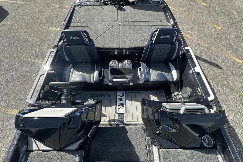 Slide: The Image of 2026 Bass Cat Lynx STS boat interior with dual seats and modern dashboard. - 7