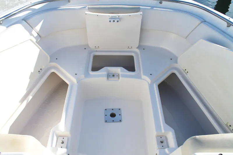 Slide: The Image of 2016 Robalo R247 Dual Console boat interior with spacious seating and storage compartments. - 30