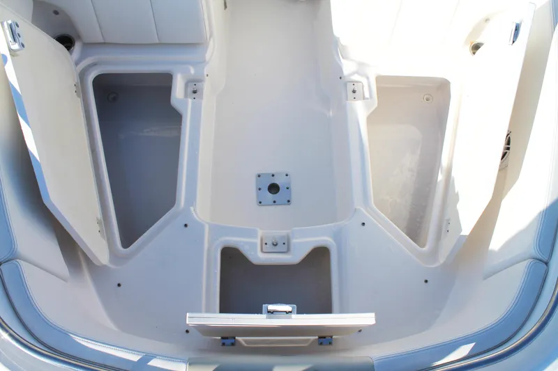 Slide: The Image of 2016 Robalo R247 Dual Console boat interior storage compartments. - 31
